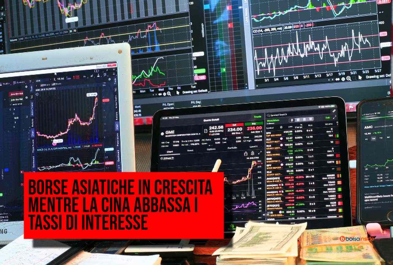 diversi schermi e tabelloni con grafici finanziari