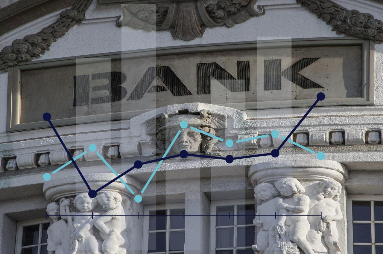 ingresso di una banca e grafico di trading