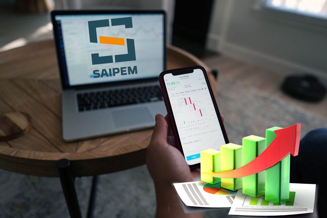 logo di saipem su laptop e grafico al rialzo