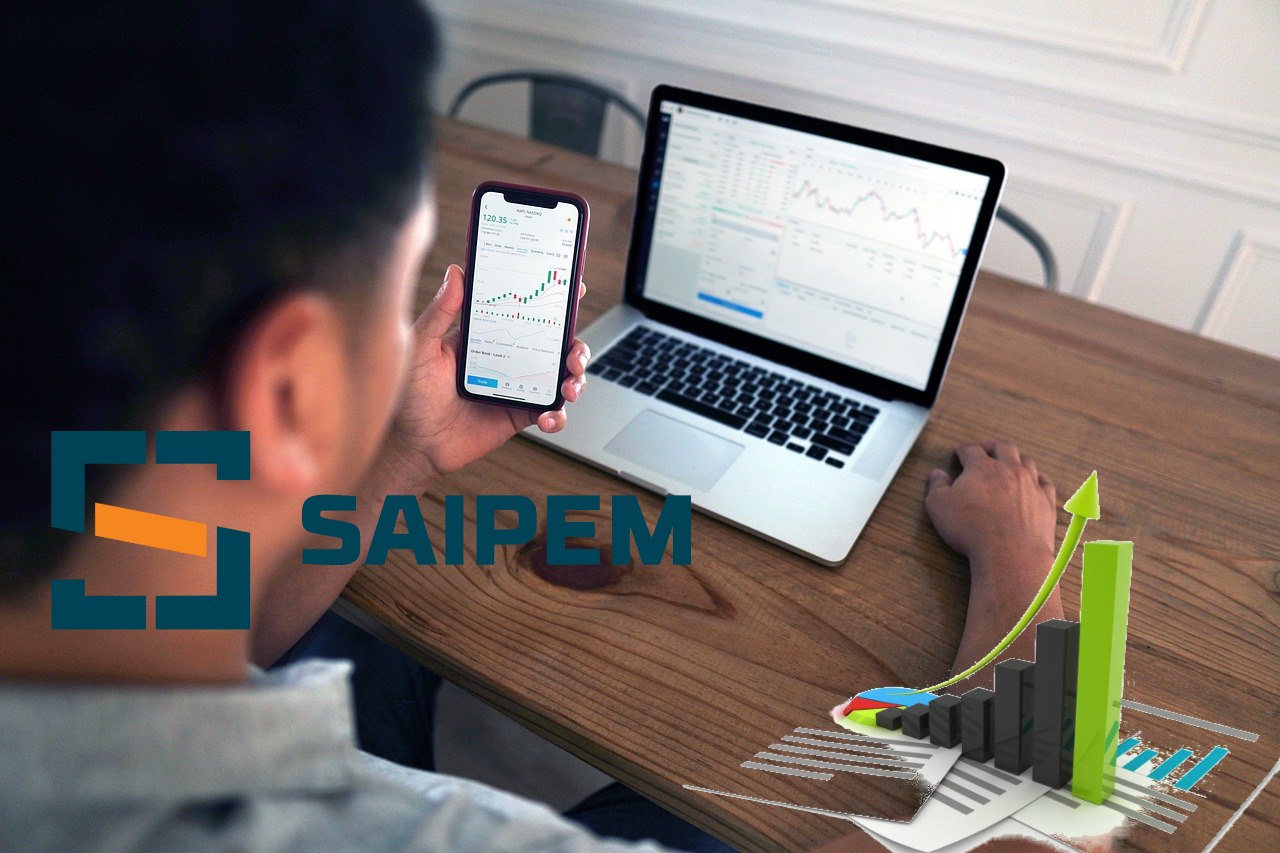 trader in azione e logo di Saipem